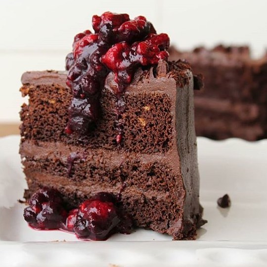 Vegan Easter Desserts, recipe #10 Beautiful reader photograph of Dreena's Sweet Potato Chocolate Cake. This photo is of the cake made in 2-layers, a slice of cake with a berry compote drizzle on top.