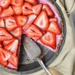 vegan strawberry pie with a slice missing from the pan