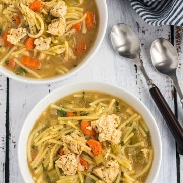 vegan chicken noodle soup in bowls