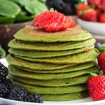 green pancakes topped with fruit